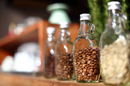 Coffee beans inside the clear bottle , Focus only subject blur background,Chiangmai ,Thailandの写真素材