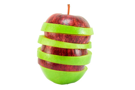 Red and green apple slice isolated on white with clipping pathの写真素材