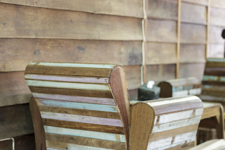 wooden chair on blurry wooden backgroundの写真素材