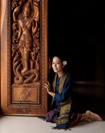 Asian woman wearing typical (Traditional) Thai dress on black background