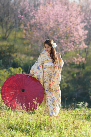 portrait of asian traditional woman with flowerの写真素材