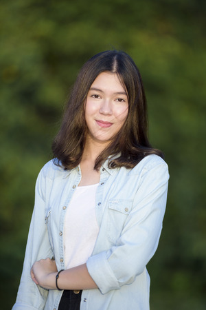 beautiful girl portrait during sunset smiley happy with nature background の写真素材
