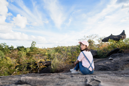 beautiful caucasian traveller with nature background, adventured girlの写真素材