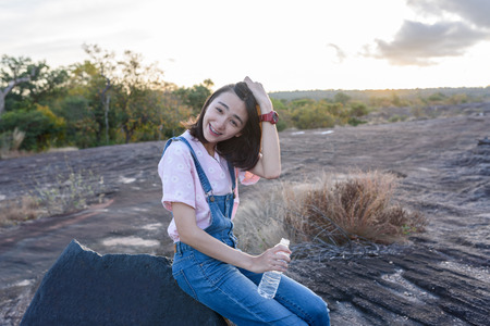 beautiful caucasian traveller with nature background, adventured girlの写真素材