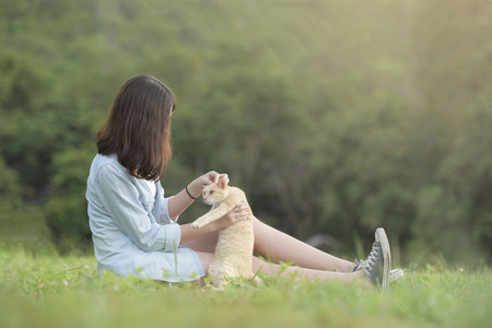 beautiful girl portrait during sunset smiley happy with nature backgroundの写真素材