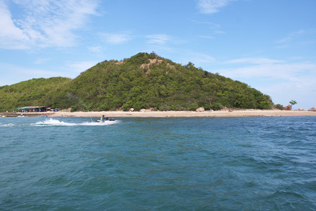 Island and blue sky with jet skiの写真素材