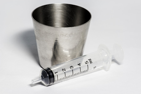 glass medicine and syringe の写真素材