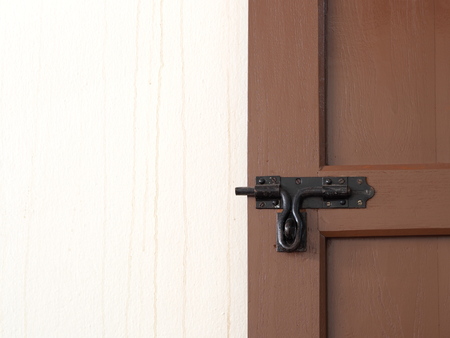 Brown wood door with lockの写真素材