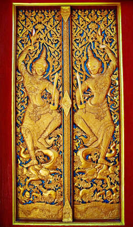 Carved wooden door goldの写真素材