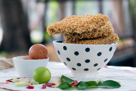Ingredient for Instant Noodle with egg, lemon, chili and herbの写真素材