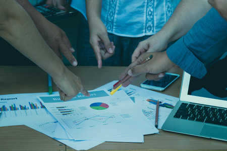 Business working team pointing the sale report for analysisの写真素材