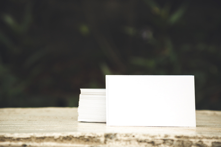 White card placing on table; blank card for input detail with copy spaceの写真素材