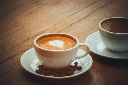 New hot latte coffee cup for replacing the empty cup; hot drink with copy spaceの写真素材