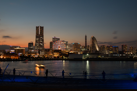 Yokohama Japan - 20 Dec 2015; many photographers are at Yokohama Port in the Sunset to capture the cityscappe lighting by viewing from Osan Bashiのeditorial素材