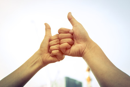 Hand of men giving Thumb finger like action after agreement