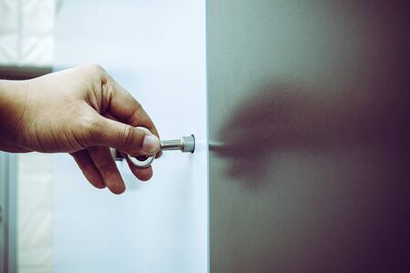 Service Engineer use key to open the machine cover for maintenance