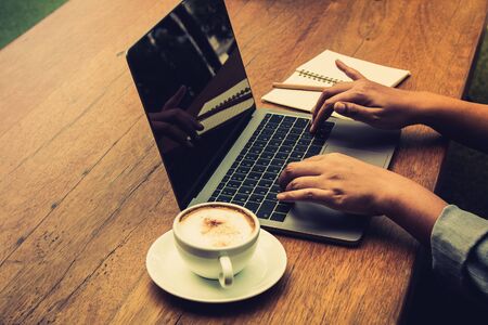 Businessman typing the data into laptop for summary; business concept