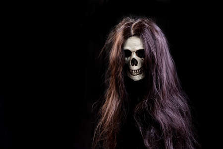 Still life halloween of human skull  with hair on black background