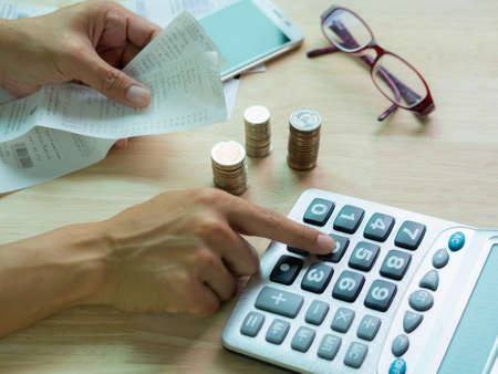 Hands using calculator.Money and financial management concept.の写真素材