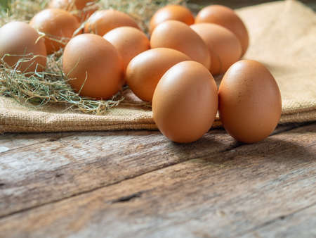 Chicken eggs.Fresh eggs on wooden backgrondの写真素材