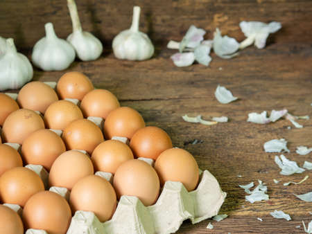 Chicken eggs.Fresh eggs in carton box on wooden backgrond.