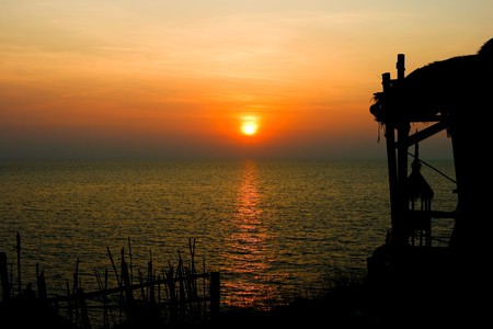 Sunset with hut sillhouette,at si chang island Thailandの写真素材