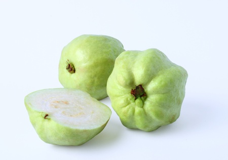 Fresh half of Guava fruit over white background の写真素材