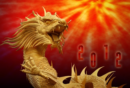 Chinese dragon statue with happy new year 2012 backgroundの写真素材