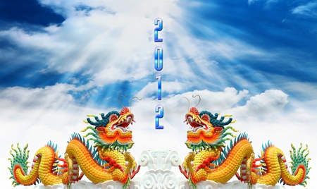 Chinese dragon statue with happy new year 2012 backgroundの写真素材
