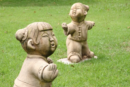 Chinese fighter statue on grass field in the garden of chinese  temple. の写真素材