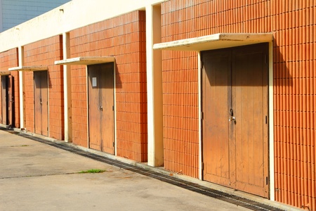 Motel corridor with many wooden closed doors の写真素材