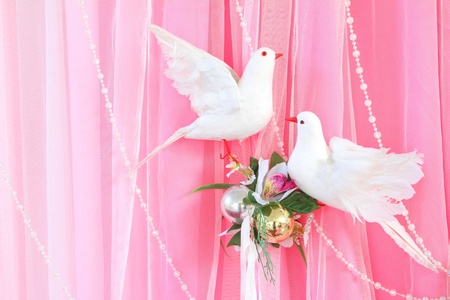 Exotic flowers arrangement over pink and white fabric, flowers background ready for wedding ceremonyの写真素材