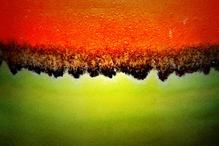 Red and green texture of ceramic surface, abstract background の写真素材