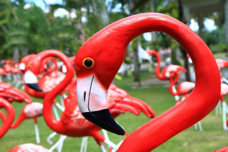 Close up of red flamingos statue in parkの写真素材