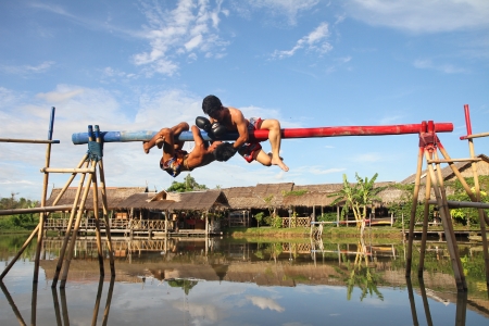 PATTATA - THAILAND - AUGUST 21: Unidentified men fight for ocean boxing in Pattaya floating market on August 21, 2011. at Pattaya Chonburi, Thailand. Ocean boxing is a  tradition of Thailand.のeditorial素材