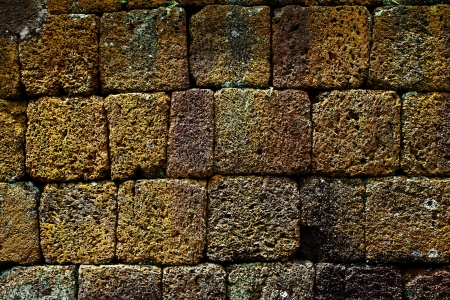 Laterite wall, The ancient castle in Thailand.の写真素材