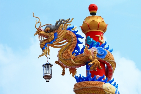 Chinese dragons statue with cloud and blue skyの写真素材
