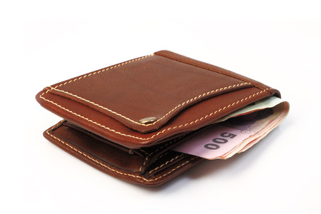 Brown leather wallet  with money isolated on white background の写真素材