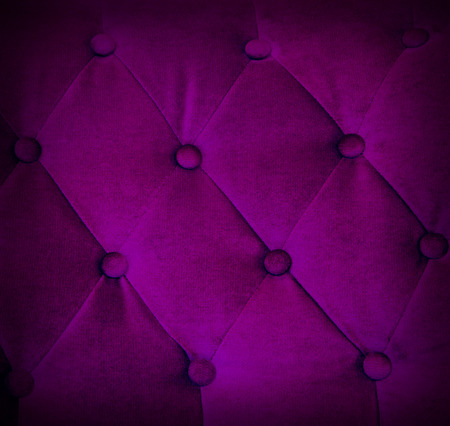 Buttoned on violet texture sofa, repeat pattern background.の写真素材