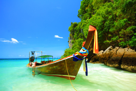 Traditional longtail boat and the clear sea at Phi Phi Don island, Andaman sea of Thailand.