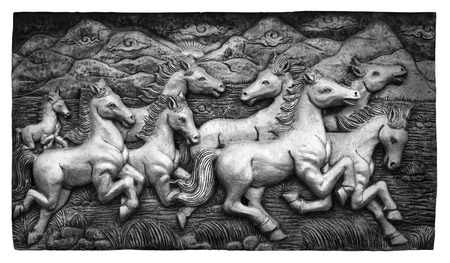 Black and white low relief cement Thai style handcraft of horse on wall, cliping path.の写真素材