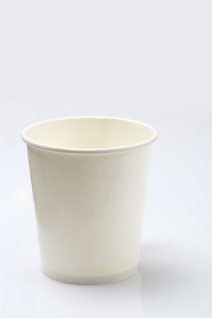 Empty paper coffee cup isolated on white backgroundの写真素材