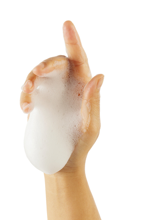Female's hand with white foam isolated on white background, clipping path.の写真素材