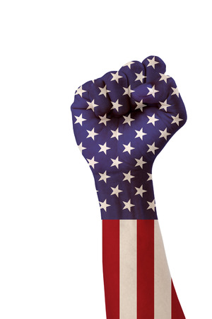 Man's hand fist on USA flag isolated on white background with clipping path.の写真素材