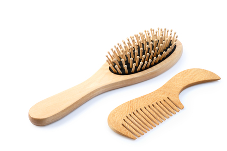 Wooden comb brush isolated on white background, clipping path.の写真素材