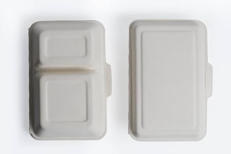 Top view of unbleached plant fiber food box isolated on white, Natural fiber eco food boxの写真素材