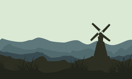 Silhouette of windmill on mountain backgrounds vector artのイラスト素材