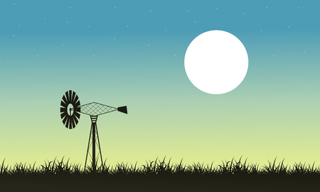 Silhouette of windmill and grass landscape vector artのイラスト素材