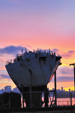 abandoned old ship and sunsetの写真素材