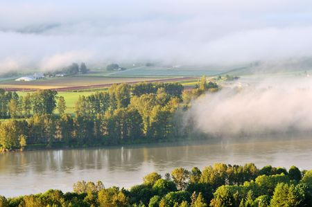 Fraser Valley at foggy sunrise, British Columbia, Canadaの写真素材